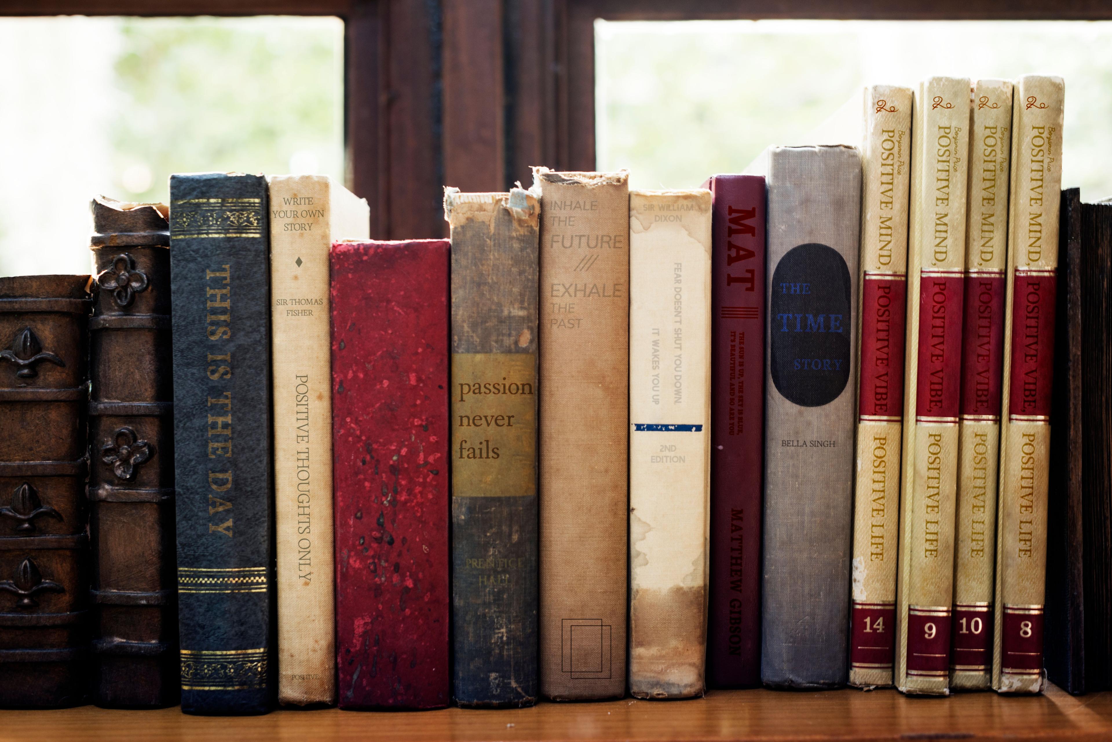 old-books-arranged-shelf.jpg