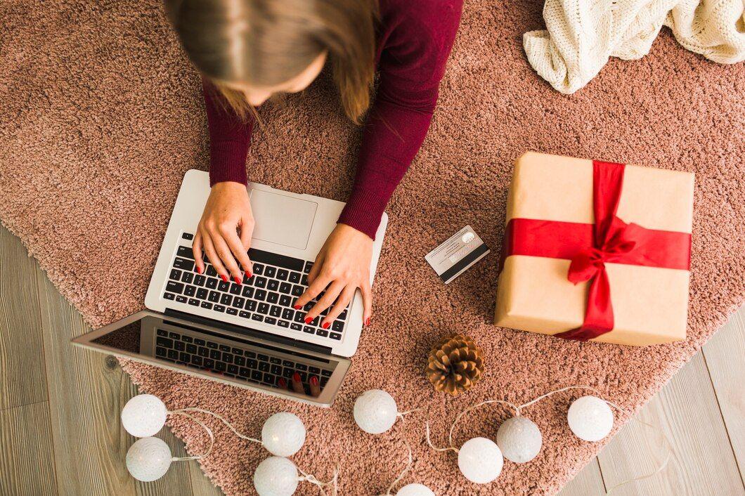 woman-with-laptop-near-plastic-card-present-box-snag-fairy-lights_23-2147973977.jpg