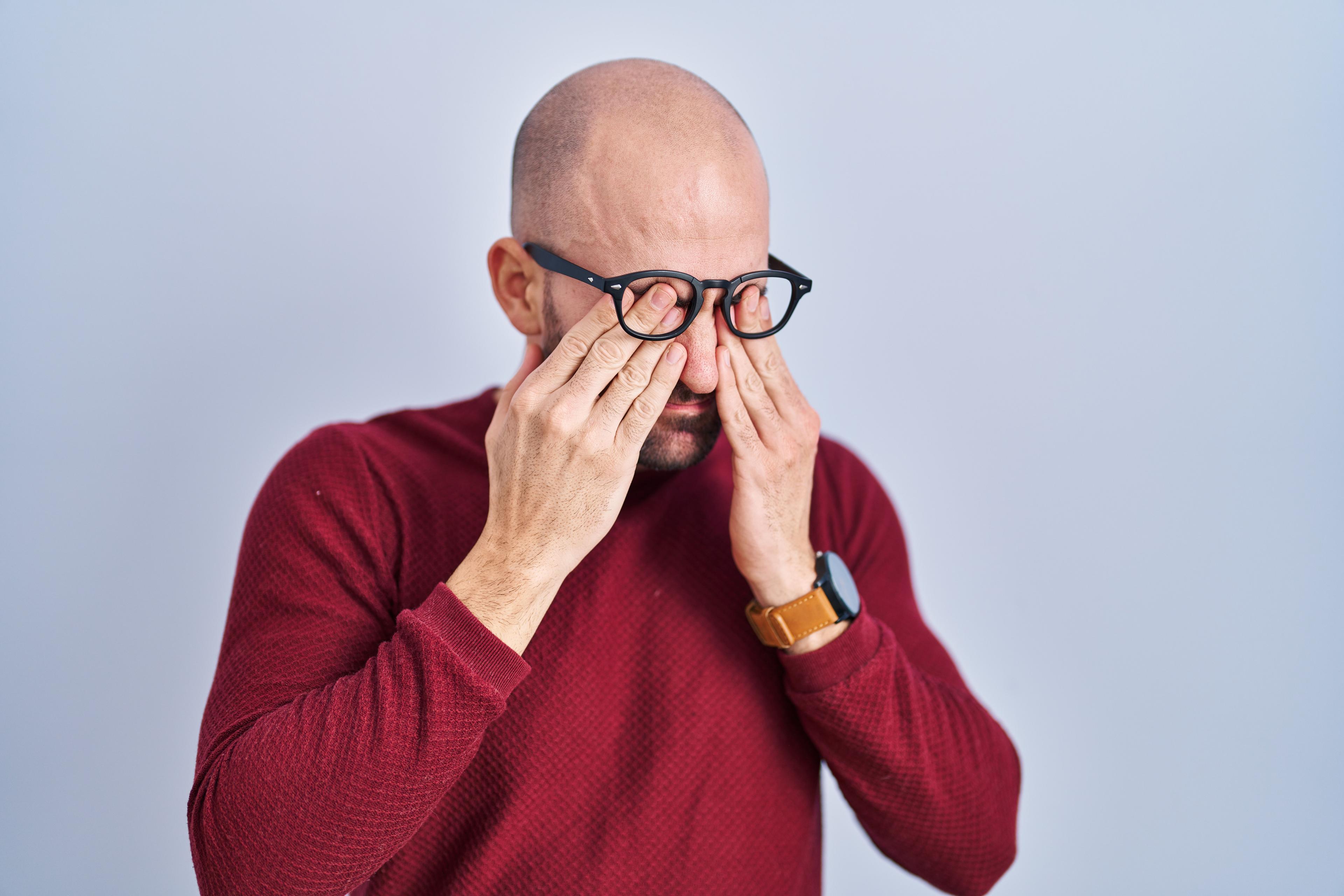 young-bald-man-with-beard-standing-white-background-wearing-glasses-rubbing-eyes-fatigue-headache-sleepy-tired-expression-vision-problem.jpg